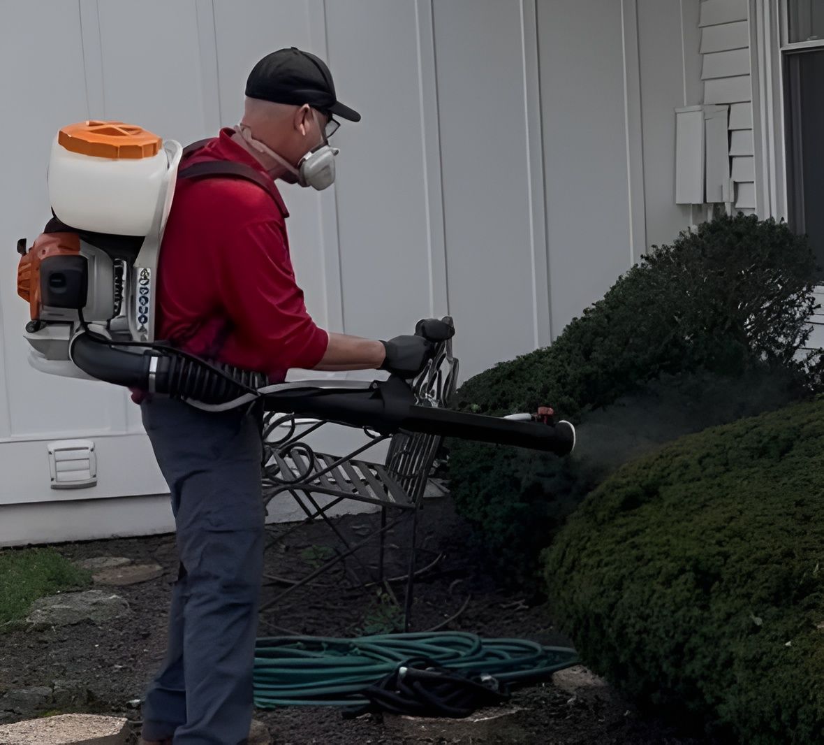 DOA Pest Service spraying outdoors